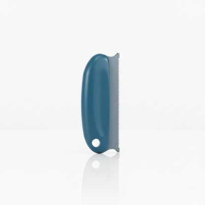Brosse anti-poils bleu pour animaux, conçue pour retirer les poils sur vêtements, tissus et meubles.