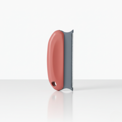 Brosse anti-poils corail pour chiens et chats, outil pratique pour textiles et surfaces.