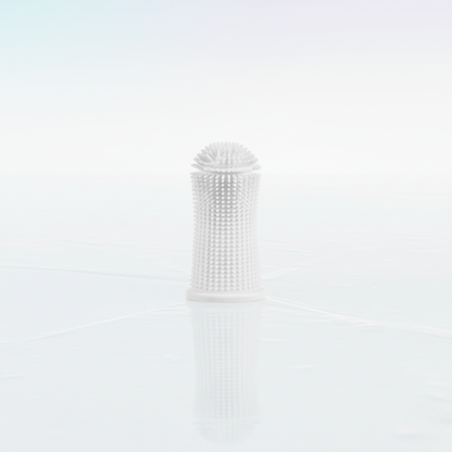 Brosse à dents en silicone blanche pour chiens et chats, spécialement conçue pour les gencives sensibles.
