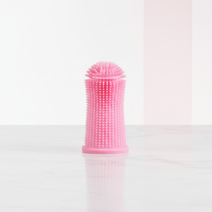 Brosse à dents en silicone rose pour chiens et chats, adaptée aux gencives fragiles.