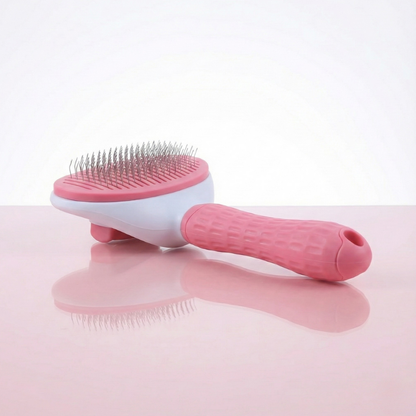 Brosse de toilettage rose pour animaux, idéale pour retirer les poils morts et démêler le pelage.